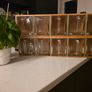 Wooden display shelf with glass jugs Image 2