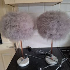 A pair of marble based feather table lamps