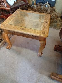 Vintage carved side table with glass cover