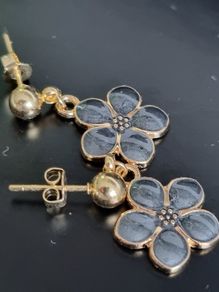 Gold plated pin earrings with enamel flowers pendants