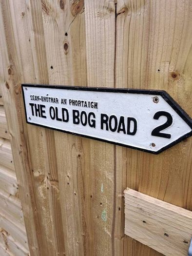 The old bog road cast iron sign