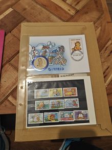 Garfield the cat half dollar and stamps