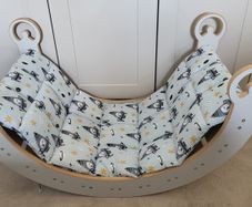 Montessori Wooden Rocking Arch with matching padded cushion.