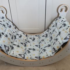 Montessori Wooden Rocking Arch with matching padded cushion.