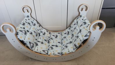 Montessori Wooden Rocking Arch with matching padded cushion.