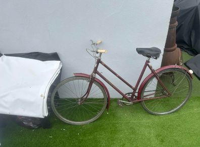 Vintage Triumph roadster (maroon, ladies step-through)