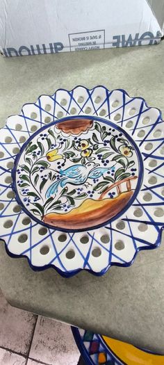 3 hanging wall plates -1- from Malta hand painted -2- from PORTGAL HAND PAINTED-3- FROM MAROCO - EACH IS 22.00 Euro.