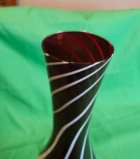 Elegant Murano-style vase made of art glass in ruby red with white spiral stripes