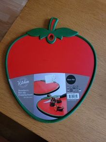 Red strawberry shaped chopping board