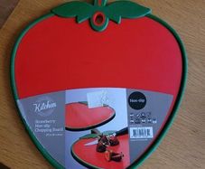 Red strawberry shaped chopping board