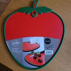 Red strawberry shaped chopping board