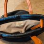David Jones  is a classic, two-tone black pebbled Faux leather bucket bag. Image 6