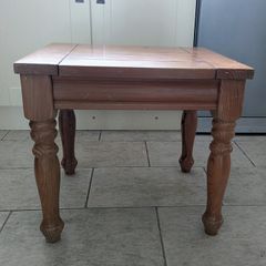 A small wooden side table