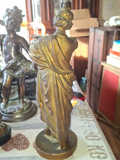 Antique Sculpture a gilt-bronze cast-metal Spanish Conquistador. On his torso is a Cross Pattee, a historical motif commonly associated with Christian military orders and medieval heraldry
