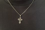 Silver tone chain necklace with rhinestone cross