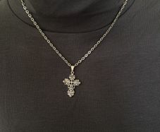 Silver tone chain necklace with rhinestone cross