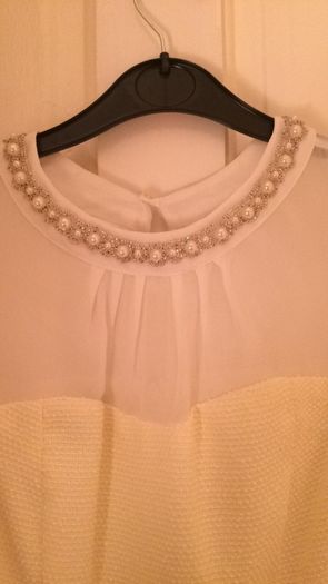 Dress with pearl neckline