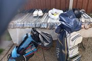 A selection of golf clubs and bags. All right handed clubs.