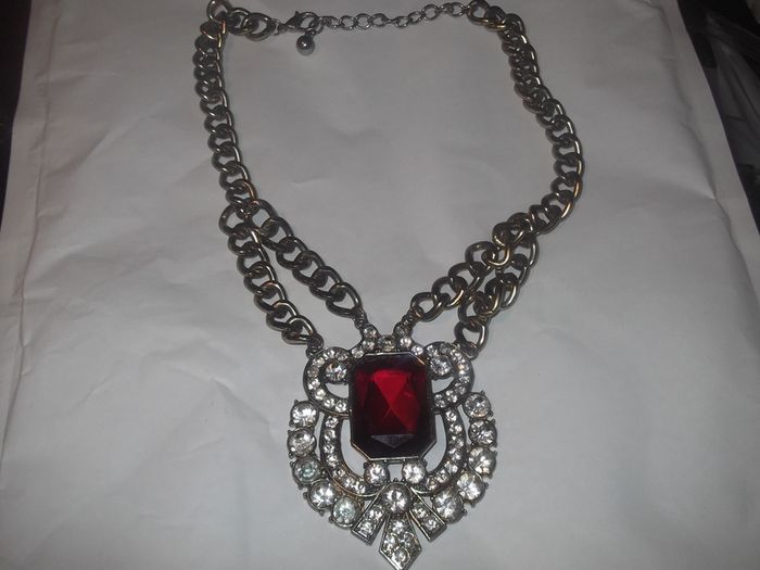 a lovely vintage  costome jewelley pendent with white stones and a large red stone