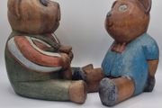 Two woodenc teddy bears