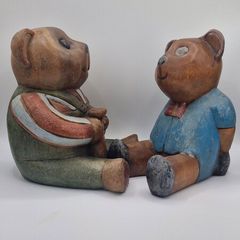 Two woodenc teddy bears