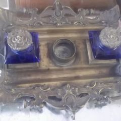 a solid antique brass ink stand with bristol blue ink holders