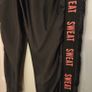 Black Ruched Bum Shiny Leggings with Orange details, size S Image 4
