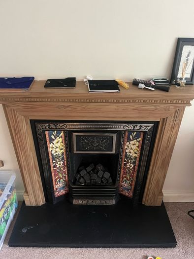 Wooden Fireplace with Tiled Cast Iron Surround