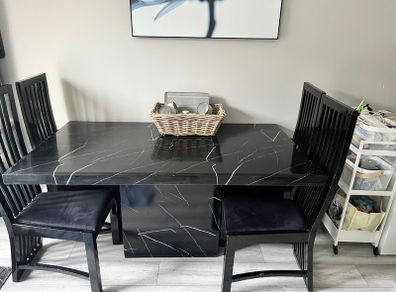 Table and chairs and glass cabinet