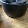 Large circular leather swivel chair and foot stool Image 6