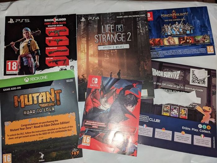 Gaming posters, manuals, DLC codes, art, post cards