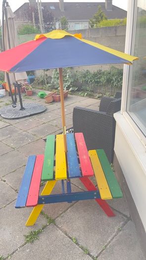 Picnic table with parasol
