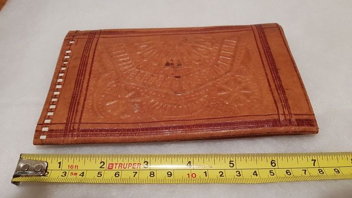 handcrafted made soft leather wallet,with designs ,, thank you,,was used,some wear and tear,,take as is ..