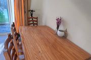 Wooden dining table with chairs
