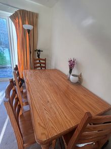 Wooden dining table with chairs