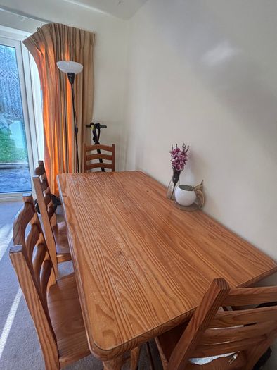 Wooden dining table with chairs