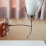 Endon matching wall sconce lights with a brushed stainless steel  finish and  clear glass shades and pull cord switch Image 2