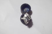 a silver dress ring with white stones  and a green stone stamped 925 china