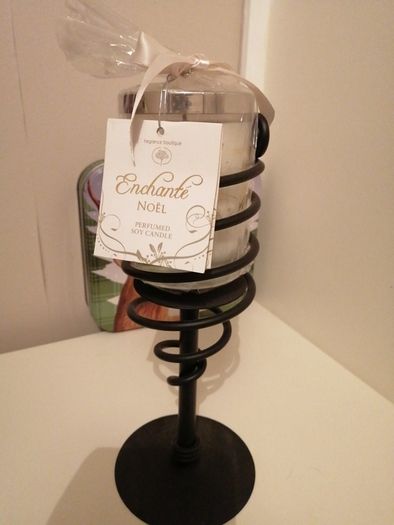 candle with wrought-iron holder.