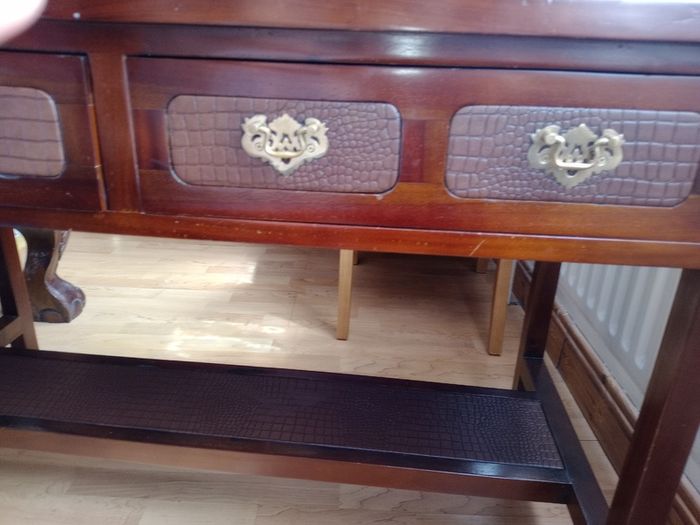 Wooden console table with faux crocodile skin detail