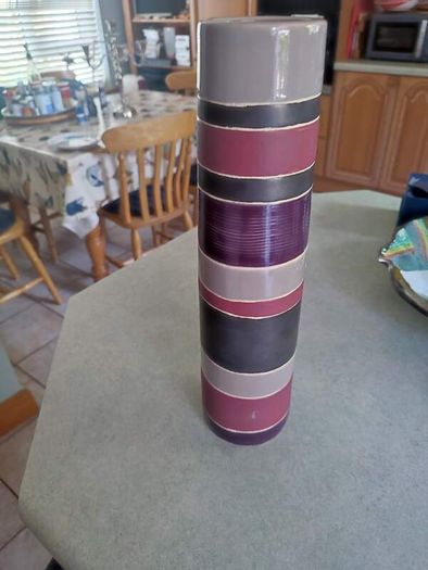 Lovely tall vase  handcrafted slight variations occur giving each product its own uniqueness.