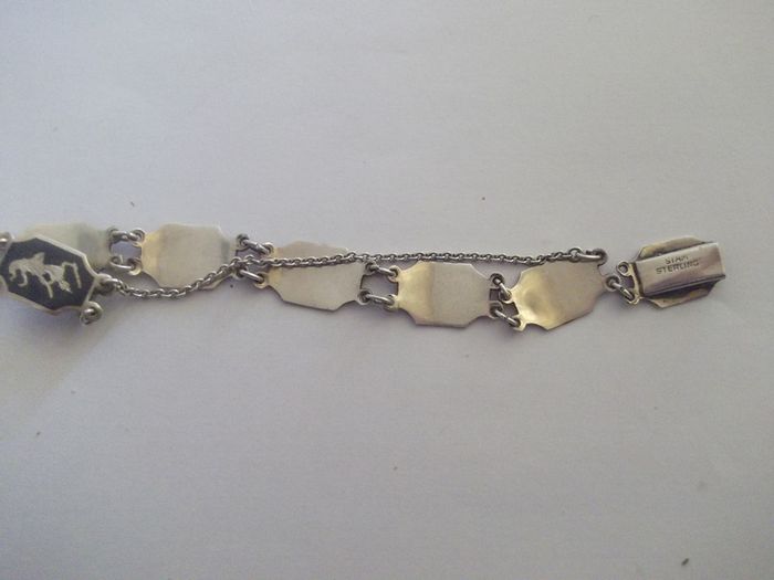 a vintage silver and enamel bracelet