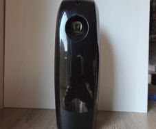 Black digital automatic air freshener dispenser.