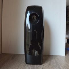 Black digital automatic air freshener dispenser.