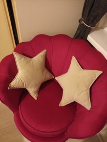 2 cream star shaped velvet cushions