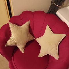 2 cream star shaped velvet cushions