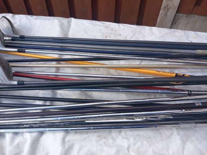 A selection of golf clubs and bags. Golf balls
