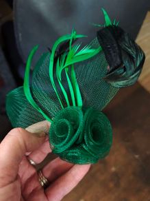 Beautiful green with both brooch and hair clip fastening Fascinator