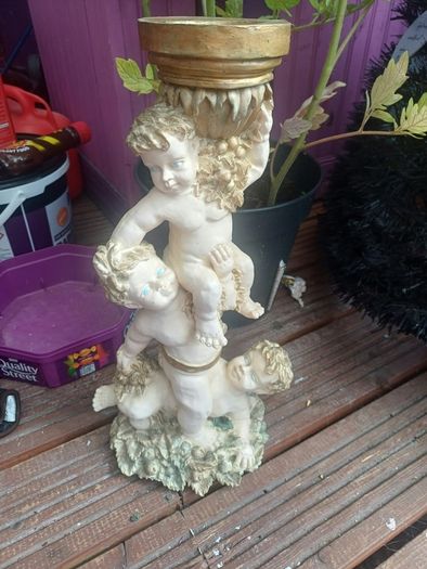 Ornate tall cherubic candle holder, D18