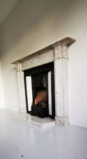 Regency Carrera Marble Bullseye Fireplace
